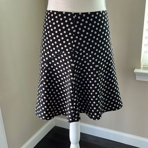 Black Skirt with Tan Polka dots and cute flippy hemline. Never worn.